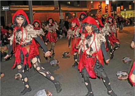  ?? CHRIS BARBER ?? Members of the Oxford Center for Dance perform a Red Riding Hood routine at the Oxford Halloween Parade on Thursday.