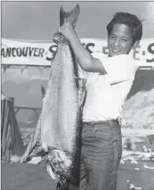  ?? BRIAN KENT/ VANCOUVER SUN FILES ?? Rennie Marr, 13, won second prize in the 1957 Vancouver Sun Salmon Derby with this 29- pound monster king salmon just minutes after starting to fish.