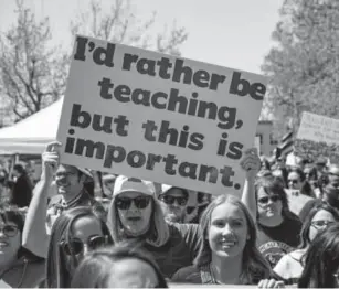  ?? Scott Heins, Getty Images ?? Oklahoma teachers and their supporters protest last Wednesday in front of the state Capitol in Oklahoma City. They are demanding increased school funding and pay raises for school workers.