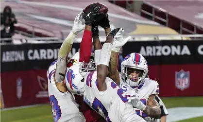  ?? Photograph: Ross D Franklin/AP ?? Arizona Cardinals wide receiver DeAndre Hopkins catches the game-winning touchdown among a bunch of defenders.