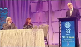  ?? Photo by Rosie Graves/Northern Inyo Healthcare District ?? Dr. Jay K. Harness, at podium, accepts the Impact Award at the National Consortium of Breast Centers annual conference held in Las Vegas last weekend. Looking on are Dr. Cary S. Kaufman, of Bellingham Regional Breast Center, and Consortium founder Dr. Barbara Rabinowitz.