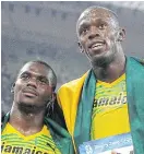  ??  ?? Nesta Carter, left, with Usain Bolt.