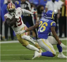  ?? Ap file ?? RUNNING SOMEWHERE ELSE? San Francisco 49ers wide receiver Deebo Samuel runs the ball against Los Angeles Rams defensive back Terrell Burgess on Jan. 9 in Inglewood, Calif.