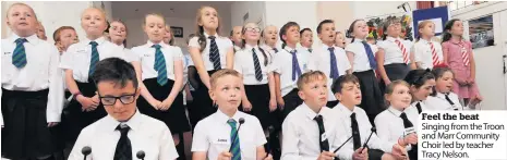  ??  ?? Feel the beat Singing from the Troon and Marr Community Choir led by teacher Tracy Nelson.