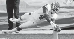  ?? QUINN HARRIS/TNS ?? Rutgers' Aaron Young dives into the end zone against Michigan State on Saturday