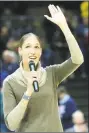  ?? Stephen Dunn / Associated Press ?? Former UConn great Rebecca Lobo waves to the crowd after receiving her Naismith Basketball Hall of Fame ring during a ceremony prior to Friday’s game in Storrs.