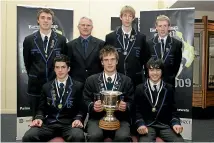  ??  ?? Coll, front left, with his Christchur­ch Boys’ High School team-mates and the Ross Norman Trophy as secondary schools champions in 2009.