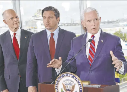  ?? Gaston De Cardenas The Associated Press ?? Vice President Mike Pence, with Sen. Rick Scott, R-Fla., left, and Florida Gov. Ron DeSantis, speaks to the media Saturday after a meeting with cruise line company leaders in Fort Lauderdale. Pence said senior citizens should avoid cruises for now.