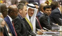  ?? RONALD ZAK / ASSOCIATED PRESS ?? Prince Abdulaziz bin Salman Al-Saud (center), minister of energy of Saudi Arabia, attends Thursday’s meeting of OPEC at the oil cartel’s headquarte­rs in Vienna, Austria.