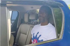  ?? (Photo: Kasey Williams) ?? Abraham Lawrence is transporte­d to the home of a relative shory after his release yesterday on bail in the St Elizabeth Parish Court after more than 20 years in prison without trial.