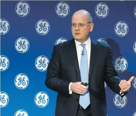  ?? ELI KABILLIO/GENERAL ELECTRIC VIA AP ?? New GE CEO John Flannery unveils his long-awaited plan to turn around the troubled company during a meeting with investors Monday in New York. GE’s stock price, down 35 per cent this year, fell on Monday by the most in two years following his...