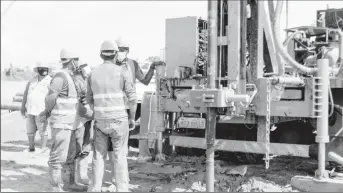  ??  ?? Workers of Foxx Trading drilling the new well at the Diamond Water Treatment Plant (GWI photo)