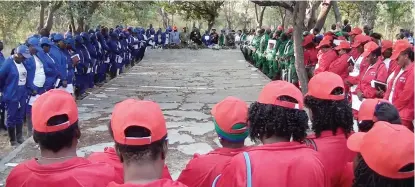  ?? Photo: Nampa ?? Survivors… Cassinga survivors surround the second and biggest mass grave where many of their fellow Namibians are buried after being killed in cold blood by the then-apartheid South African paratroope­rs on 4 May 1978.