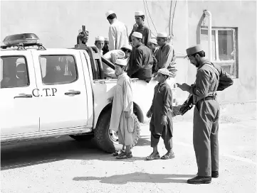  ??  ?? Afghan children, who were released from being held by kidnapping gangs, are brought to the police headquarte­rs in Ghazni province. The rescue this summer of dozens of Afghan youths destined for Pakistan religious schools to be trained as Taliban...