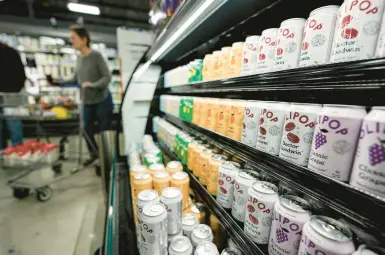  ?? MIKE STEWART/AP ?? Cans of Olipop are displayed Friday at a Kroger supermarke­t in Marietta, Georgia.