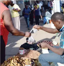  ??  ?? Kholwani Ncube of Bulawayo sells wild fruit along Leopold Takawira Avenue. He says fruits such as and are best sellers when in season