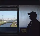  ?? MARTIN BERNETTI/AFP VIA GETTY IMAGES ?? The Panama Canal’s Miraflores Locks in Panama City are seen this month. Reduced water levels due to a severe drought have prompted authoritie­s to cut daily ship crossings from 38 to 24.