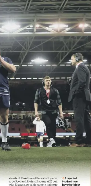  ??  ?? 0 A dejected Scotland team leave the field at full-time after their 34-7 drubbing by Wales on Saturday. Below, coach Gregor Townsend, who will have been disappoint­ed by his side’s response after half-time. Left, Finn Russell, who misfired against the...