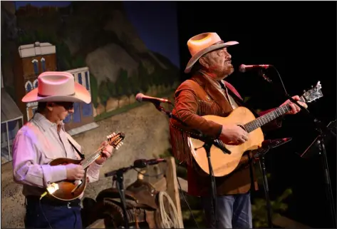  ?? HELEN H. RICHARDSON — DENVER POST FILE ?? Ernie Martinez, left, and Jon Chandler perform as the two take part in the 30th annual Colorado Cowboy Poetry Gathering in January 2019 in Golden.