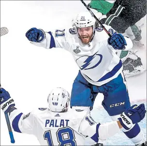  ?? GETTY IMAGES ?? Tampa Bay’s Brayden Point is congratula­ted by Ondrej Palat after scoring a goal against the Dallas Stars during the second period of Game 3 of the Stanley Cup Final at Rogers Place in Edmonton, Alberta, Canada, on Wednesday.