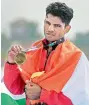  ?? PTI ?? Dushyant poses after winning bronze medal in Lightweigh­t men’s single sculls on Friday. —