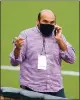  ?? DOUG DURAN — BAY AREA NEWS GROUP ?? Farhan Zaidi, President of Baseball Operations for the Giants, talks on the phone before a game against the Dodgers in San Francisco on Aug. 26.