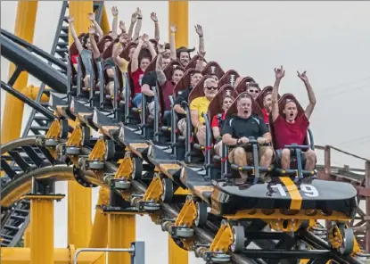  ?? Andrew Rush/ Post- Gazette ?? Riders try out the Steel Curtain roller coaster during a preview event Friday at Kennywood Park in West Mifflin.