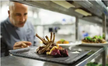  ??  ?? Yousef Hanna, owner and chef of Magdalena, in Tiberias. Credit Uriel Sinai for The New York Times