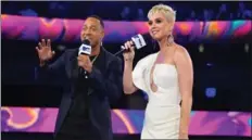  ??  ?? Terrence J, left, and Katy Perry onstage at the MVAs Sunday.