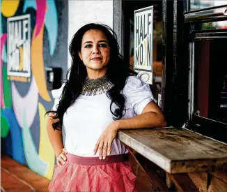  ?? SCOTT MCINTYRE/NEW YORK TIMES ?? Pilar Guzman Zavala founded Half Moon Empanadas, a small chain of restaurant­s, in Florida 12 years ago. She employed 100 before the pandemic. But her PPP applicatio­n stalled at the first two lenders she tried, forcing her to spend a month hunting before she found a local bank to process her loan.