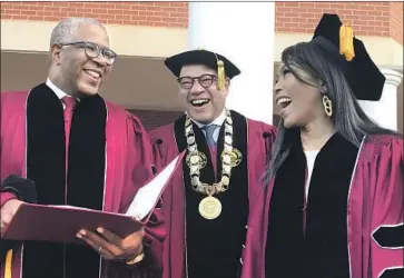  ?? Bo Emerson Atlanta Journal-Consitutio­n ?? ROBERT F. SMITH, left, laughs with Morehouse College President David A. Thomas and actress Angela Bassett at the Sunday morning graduation ceremony. Smith and Bassett each received honorary doctorates.
