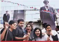  ?? PHOTO: PTI ?? Rajinikant­h fans cheering outside a cinema hall to celebrate the release of his film, Kabali ,in Chennai