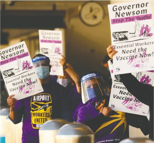  ?? PATRICK T. FALLON / AFP VIA GETTY IMAGES FILES ?? Airport workers with the Service Employees Internatio­nal Union protest in Los Angeles recently and call on California Governor Gavin Newsom to support vaccine priority for essential workers in the Covid-19 pandemic.