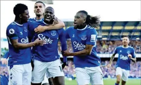  ?? ?? Alex Iwobi (right) celebratin­g Abdoulaye Doucoure’s lone winner against Bournemout­h on the last day of the 2022/23 Premier League season...on Sunday