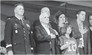  ?? MICHAEL CONROY AP ?? Vice President Mike Pence stands as the national anthem plays Sunday. He left shortly after.