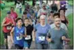  ??  ?? People of all ages getting a good running start from the beginning of a 5K race held at Riverfront Park in Pottstown. The course was along the Schuylkill River Trail.