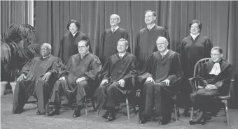  ?? 2010 PHOTO BY H. DARR BEISER, USA TODAY ?? The Supreme Court sits for a portrait after Elena Kagan, top right, joined. She has become a savvy questioner and witty writer who pushes back against her conservati­ve colleagues.