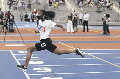  ?? ANTHONY VAZQUEZ/SUN-TIMES PHOTOS ?? Symone Frison crosses the finish line at the Fastest Kids in Chicago finals at Gately Park on Saturday.