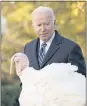  ?? ?? President Joe Biden checks out Peanut Butter during the humor-filled ceremony in the Rose Garden.