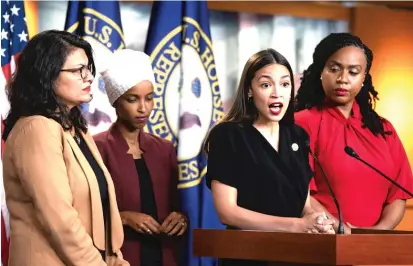  ?? AP ?? U.S. Rep. Alexandria Ocasio-Cortez, D-N.Y., speaks Monday at a news conference attended by other congresswo­men urged by President Trump to leave the country. From left: Rashida Tlaib, D-Mich., Rep. Ilhan Omar, D-Minn., and Rep. Ayanna Pressley, D-Mass.