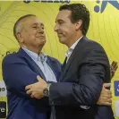  ?? Photograph: Domenech Castello/EPA ?? Unai Emery (right) and the Villarreal president, Fernando Roig, embrace during his farewell press conference.