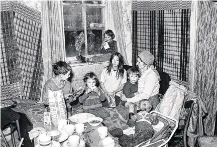  ?? PHOTO: GETTY ?? We’ve come a long way:
A large family of three generation­s living in the Benburb Street area of Dublin in 1968 – by 2018, Ireland had the secondlowe­st rate of under-60s being at risk of poverty.