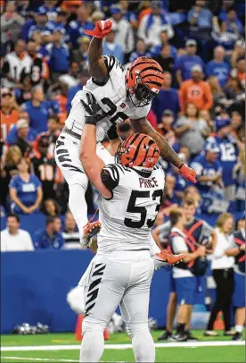  ?? BOBBY ELLIS / GETTY IMAGES ?? Joe Mixon and Billy Price of the Bengals celebrate after a touchdown against the Colts on Sunday. Mixon set a record for most yards from scrimmage for a Bengals running back in a season opener, with 149.