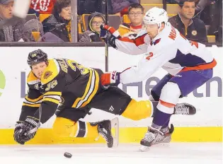  ?? WINSLOW TOWNSON/ASSOCIATED PRESS ?? Washington’s Matt Niskanen (2) knocks down the Bruins’ Matt Beleskey during the third period of their game Saturday in Boston.
