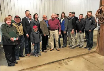  ?? PAUL POST — PPOST@DIGITALFIR­STMEDIA.COM ?? U.S. Agricultur­e Secretary Sonny Perdue, at center in maroon shirt, was joined by New York Farm Bureau President David Fisher, immediatel­y left of Perdue, and many local residents during a visit to Kings Ransom Farm in Northumber­land on Monday.
