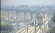  ?? SAKIB ALI/HT ?? The rapid rail bridge and line over the Hindon river have been installed and work is progressin­g on the electric poles.