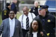  ?? ASSOCIATED PRESS FILE PHOTO ?? Bill Cosby, center, arrives for his sexual assault trial at the Montgomery County Courthouse, Thursday, April 5, 2018, in Norristown.