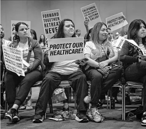  ?? Jason Armond Los Angeles Times ?? PEOPLE attend a town hall in October. A union representi­ng healthcare workers is behind the tax proposal.
