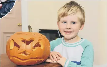  ??  ?? Pumpkin carving is one activity that can be done at home – with pumpkins picked up on the supermarke­t run