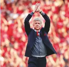  ?? AP ?? ■ Arsenal manager Arsene Wenger applauds before his lap of honour at the Emirates Stadium on Sunday. The match is Wenger’s last home game in charge.